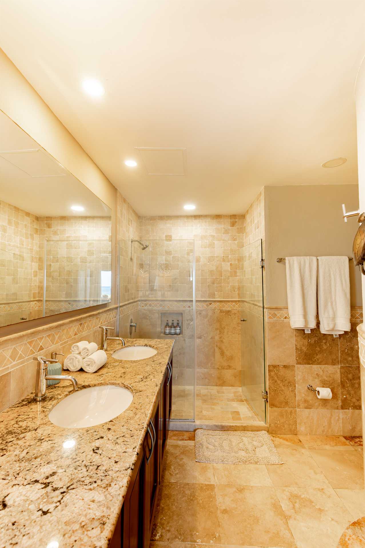 Master bath with glass shower, double sinks